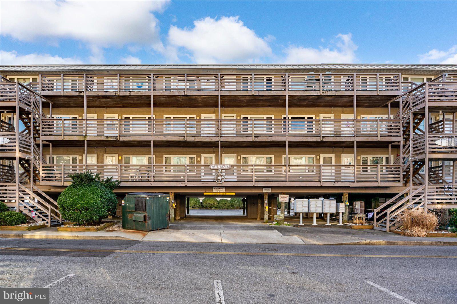 9 46th Street, Unit 22 Ocean City, MD 21842 - Photo 2 of 43 a front view of a building with a street