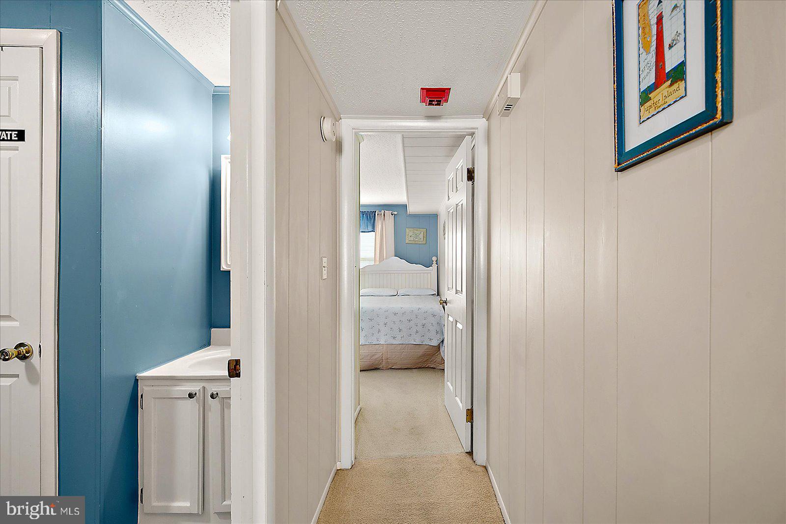 9 46th Street, Unit 22 Ocean City, MD 21842 - Photo 26 of 43 a view of a hallway with closet and bathroom