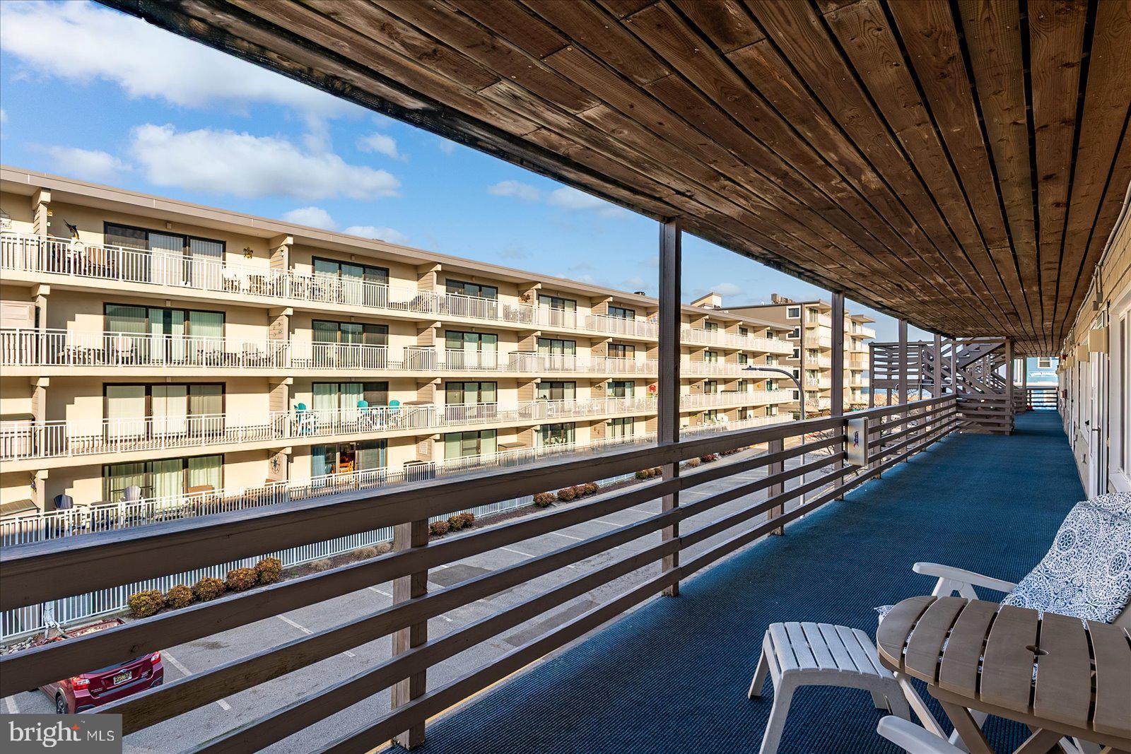 9 46th Street, Unit 22 Ocean City, MD 21842 - Photo 32 of 43 a view of a city from a balcony with furniture