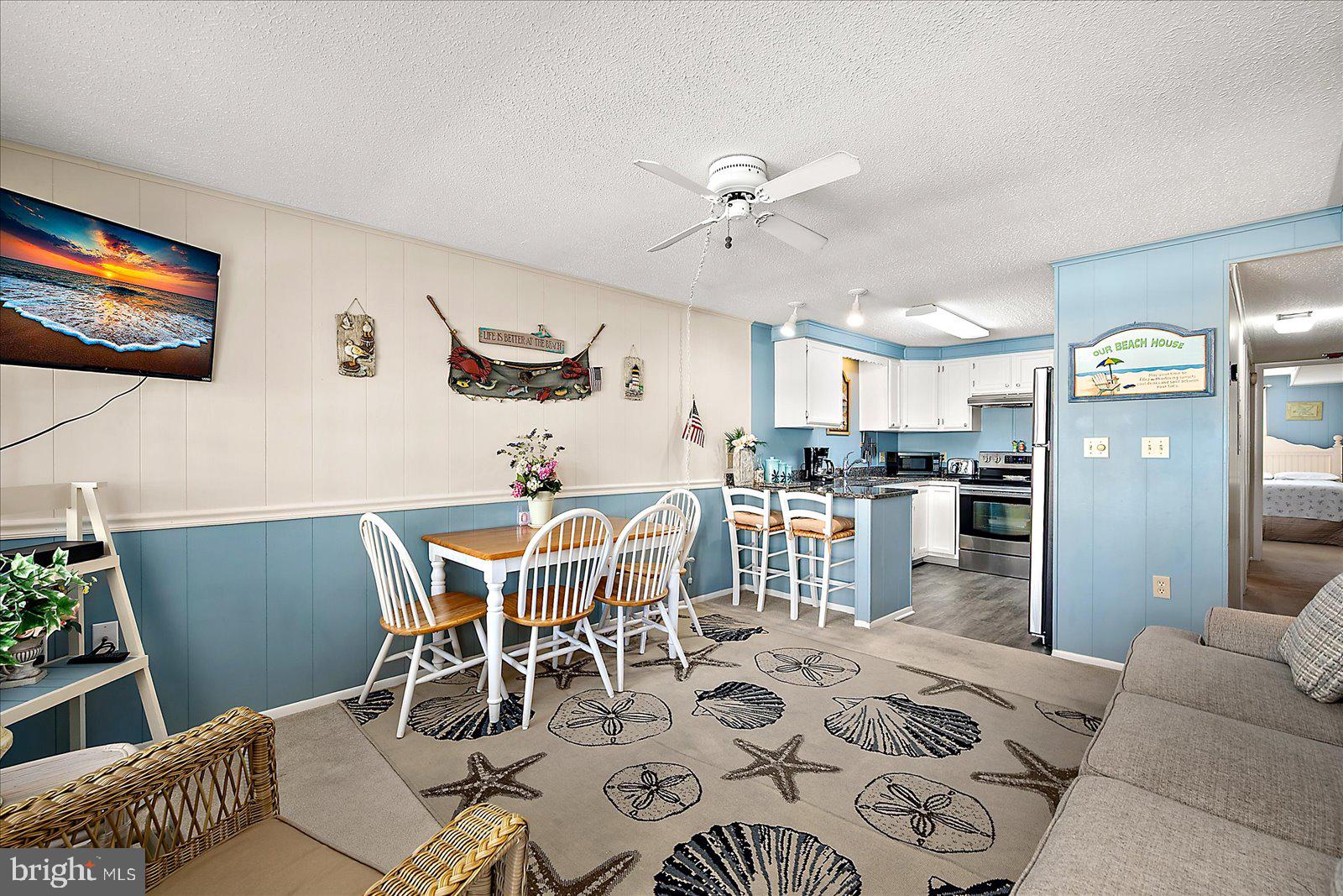 9 46th Street, Unit 22 Ocean City, MD 21842 - Photo 4 of 43 a view of a dining room with furniture