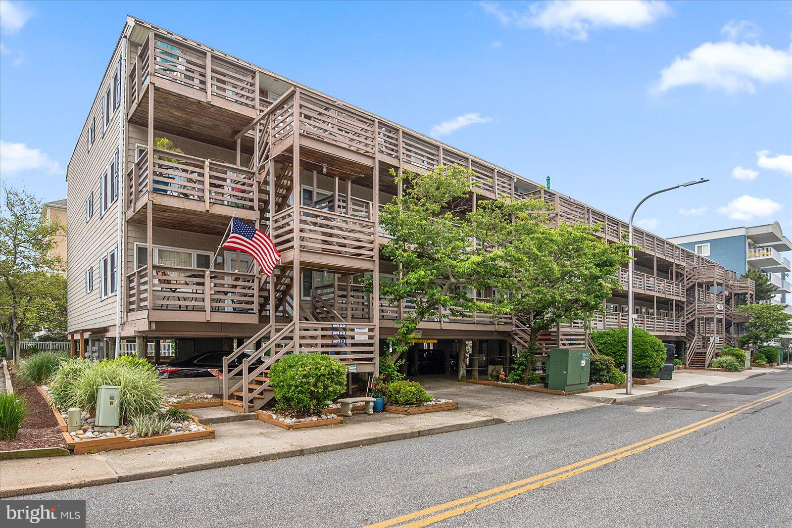 9 46th Street, Unit 22 Ocean City, MD 21842 - Photo 41 of 43 a front view of a house with garden