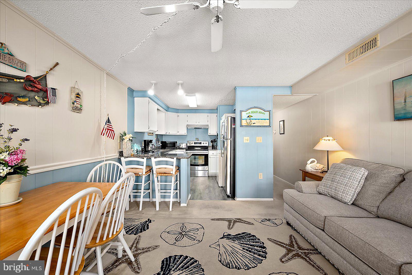 9 46th Street, Unit 22 Ocean City, MD 21842 - Photo 5 of 43 a living room with furniture and kitchen view