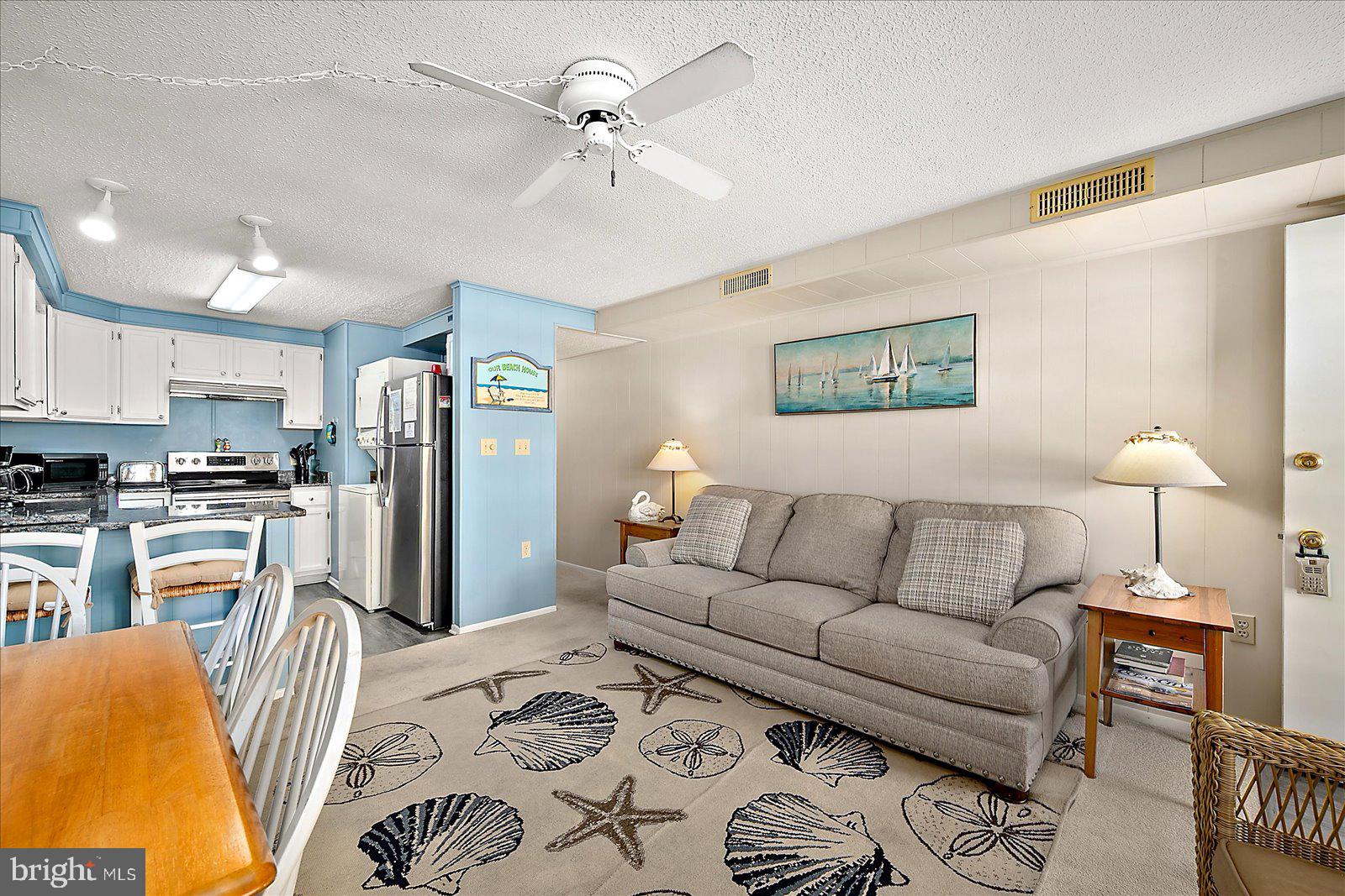 9 46th Street, Unit 22 Ocean City, MD 21842 - Photo 6 of 43 a living room with furniture and kitchen view