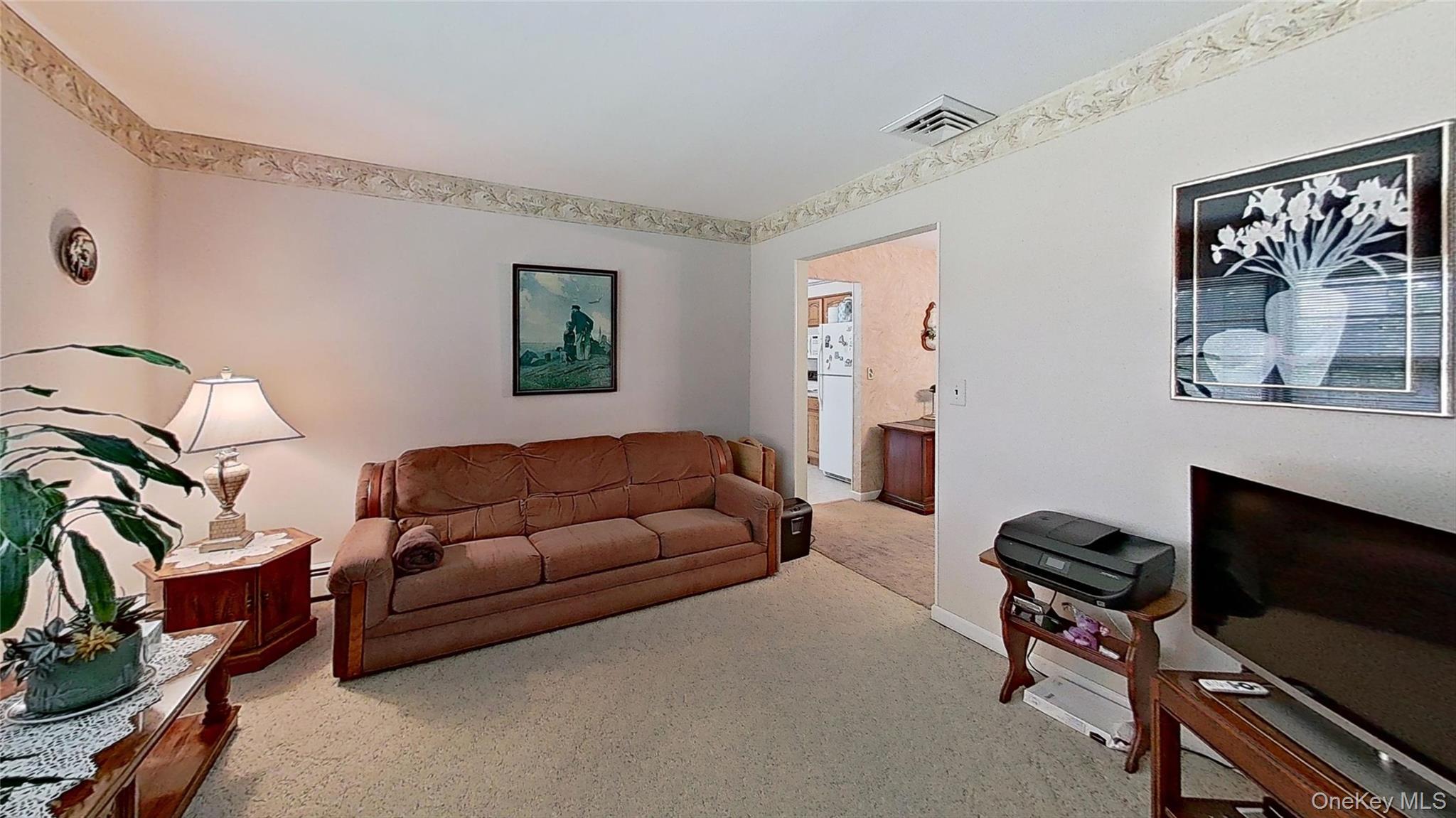 347 Miller Place Road Miller Place, NY 11764 - Photo 10 of 29 A cozy room with space for many.