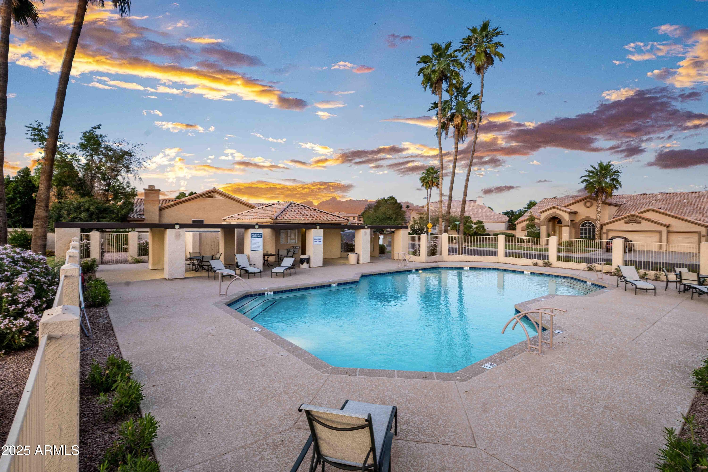 1398 West Windhaven Avenue Gilbert, AZ 85233 - Photo 50 of 58 a view of a swimming pool with a patio