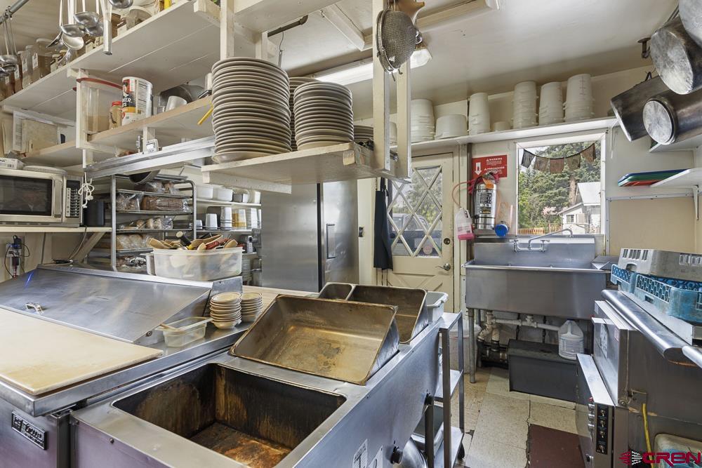 595 East 7th Avenue Durango, CO 81301 - Photo 11 of 34 a kitchen that has a lot of cabinets in it