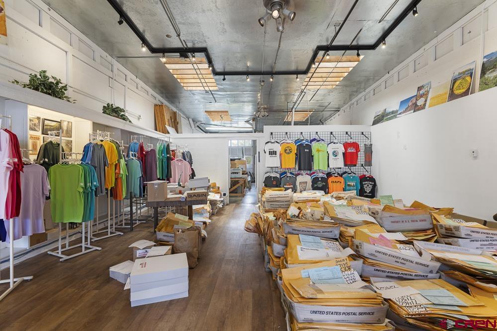 595 East 7th Avenue Durango, CO 81301 - Photo 27 of 34 a living room with lots of furniture and kitchen view