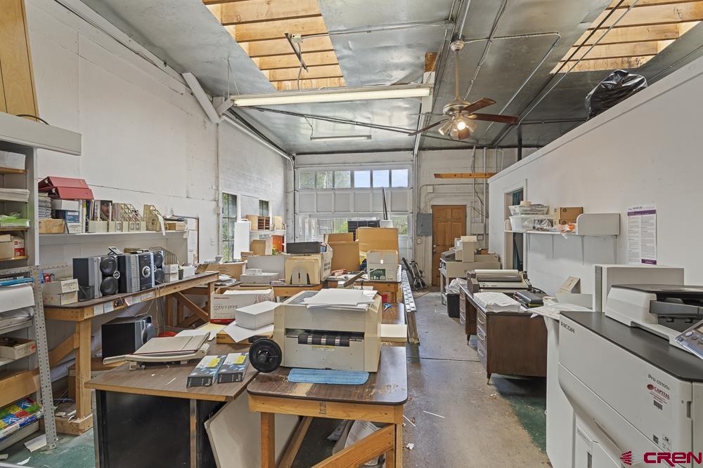 595 East 7th Avenue Durango, CO 81301 - Photo 28 of 34 a kitchen with lots of appliances and a table