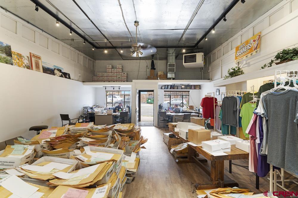 595 East 7th Avenue Durango, CO 81301 - Photo 30 of 34 a view of a dining room with furniture wooden floor and a chandelier