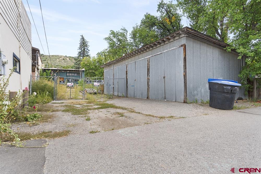 595 East 7th Avenue Durango, CO 81301 - Photo 32 of 34 a backyard of a house with barbeque oven and outdoor seating