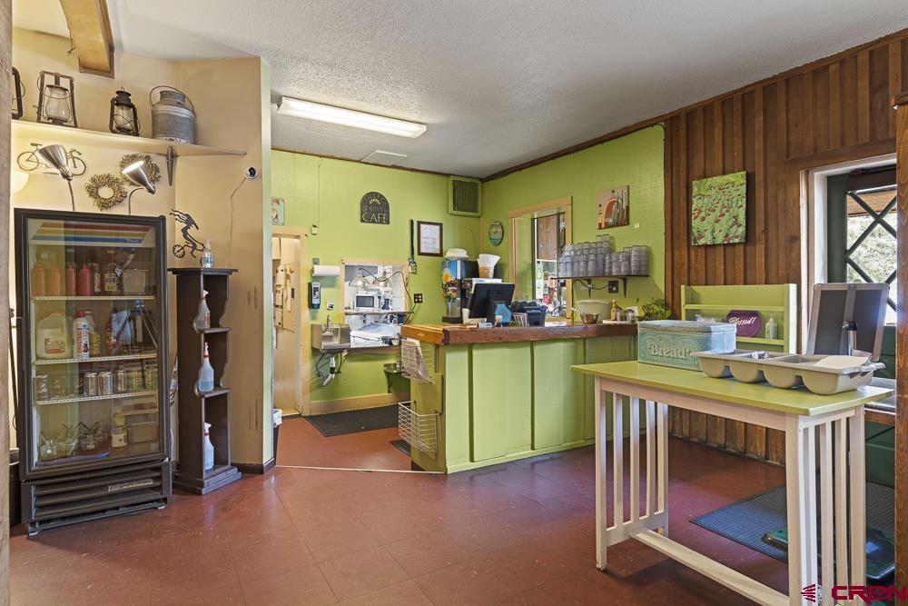 595 East 7th Avenue Durango, CO 81301 - Photo 6 of 34 a kitchen with a refrigerator and a sink