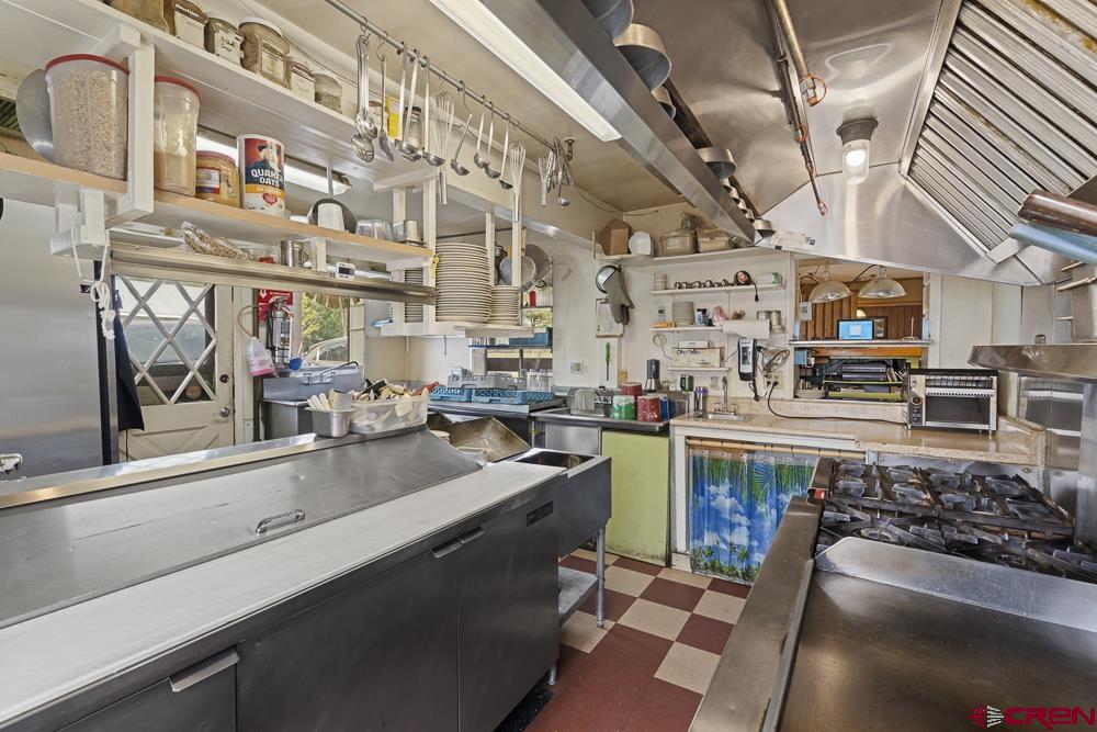 595 East 7th Avenue Durango, CO 81301 - Photo 8 of 34 a kitchen with lots of counter top space and stainless steel appliances