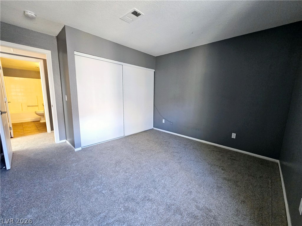9325 West Desert Inn Road, Unit 229 Las Vegas, NV 89117 - Photo 13 of 17 Plush wall-to-wall carpeting and sliding closet doors define this private bedroom retreat.