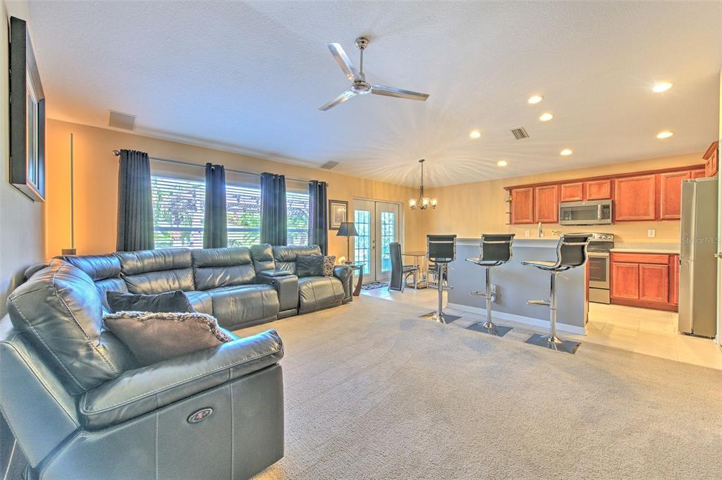 7352 Bridgeview Drive Zephyrhills, FL 33545 - Photo 24 of 49 a living room with furniture and a large window