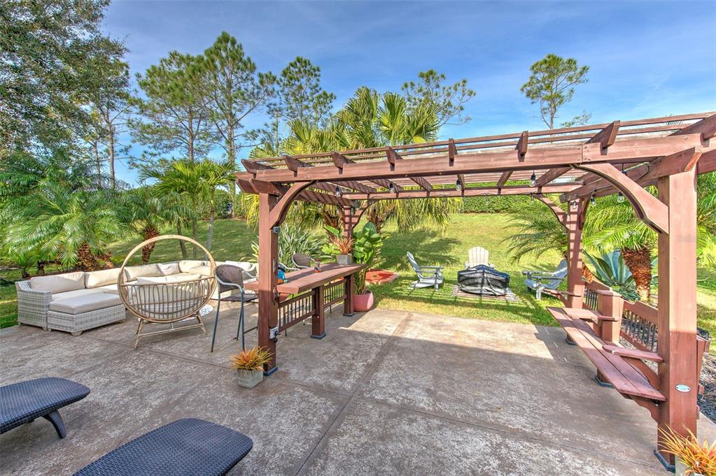7352 Bridgeview Drive Zephyrhills, FL 33545 - Photo 38 of 49 a view of an outdoor space with seating