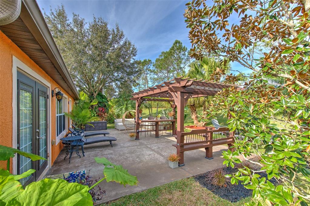 7352 Bridgeview Drive Zephyrhills, FL 33545 - Photo 39 of 49 a garden view with a seating space