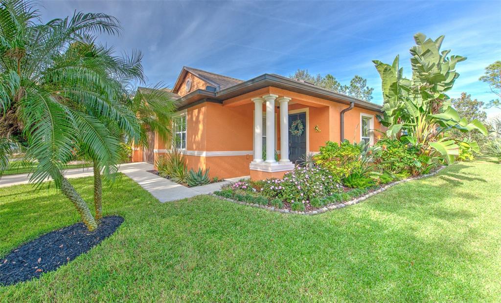 7352 Bridgeview Drive Zephyrhills, FL 33545 - Photo 4 of 49 a front view of a house with a yard
