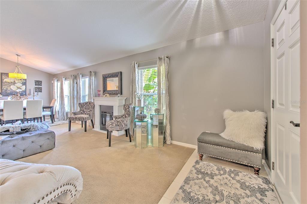 7352 Bridgeview Drive Zephyrhills, FL 33545 - Photo 8 of 49 a bedroom with furniture and a couch