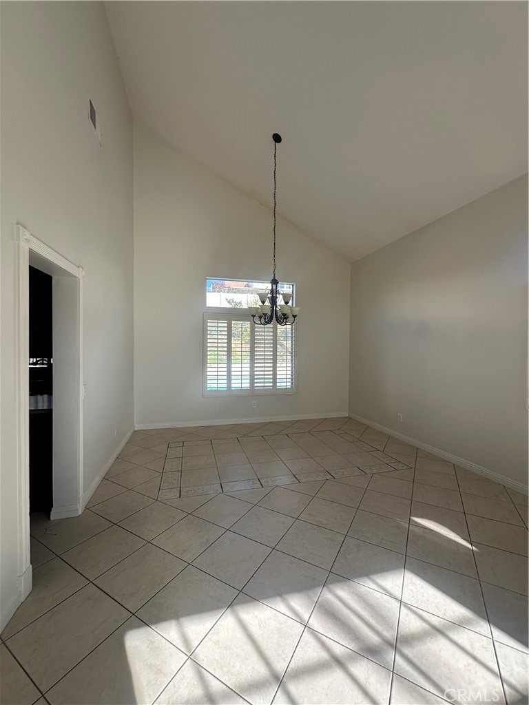 29652 Chandler Road Highland, CA 92346 - Photo 4 of 22 a view of an empty room and window