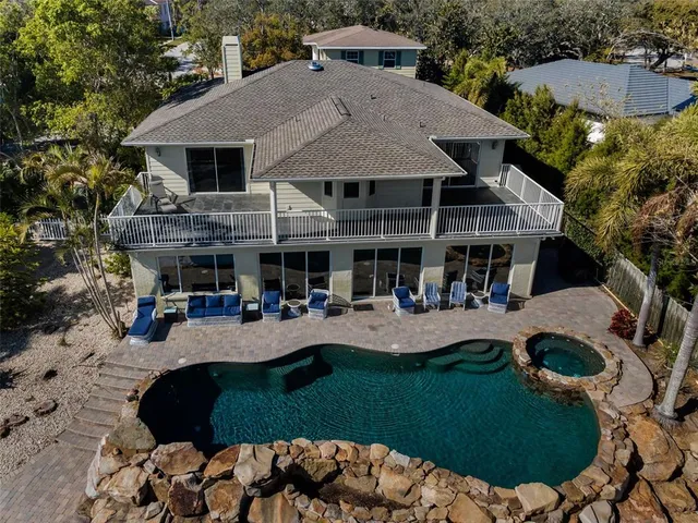 a view of roof deck with two chairs and wooden floor