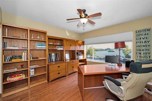 a spacious bedroom with a bed and a flat screen tv