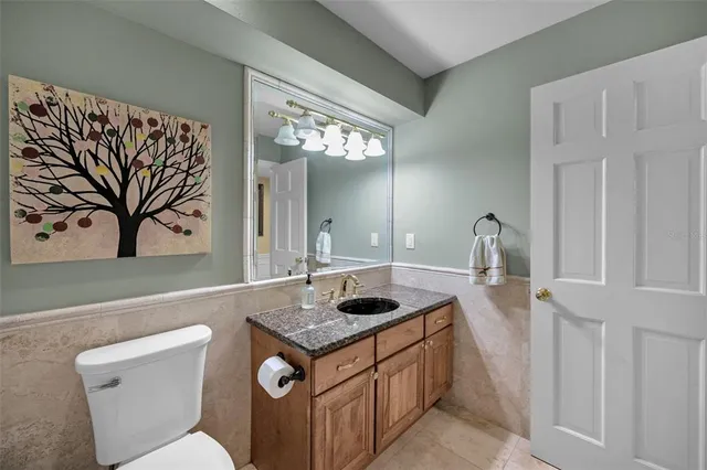 a bathroom with a shower curtain and a sink