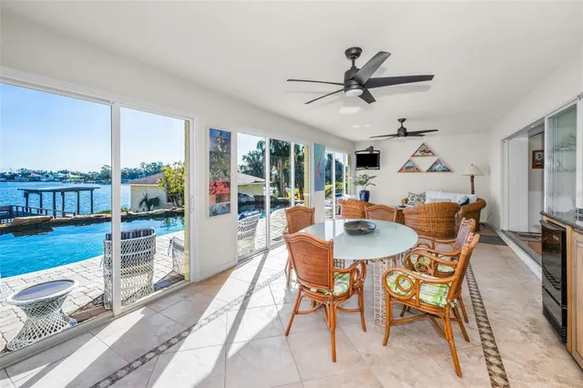 a room with lots of furniture and a large window