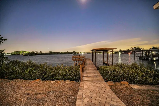 an aerial view of multiple houses with yard