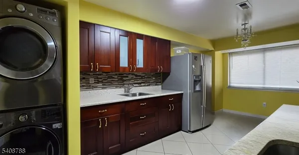 a view of a kitchen with washer and dryer