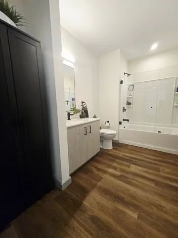 a bathroom with a sink a toilet and a tub