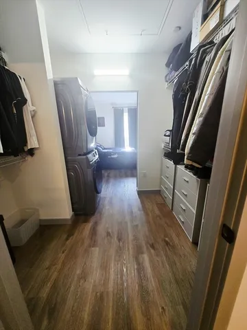 a view of a kitchen with wooden floor and staircase