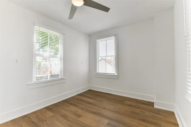 a kitchen with a refrigerator stove and white cabinets