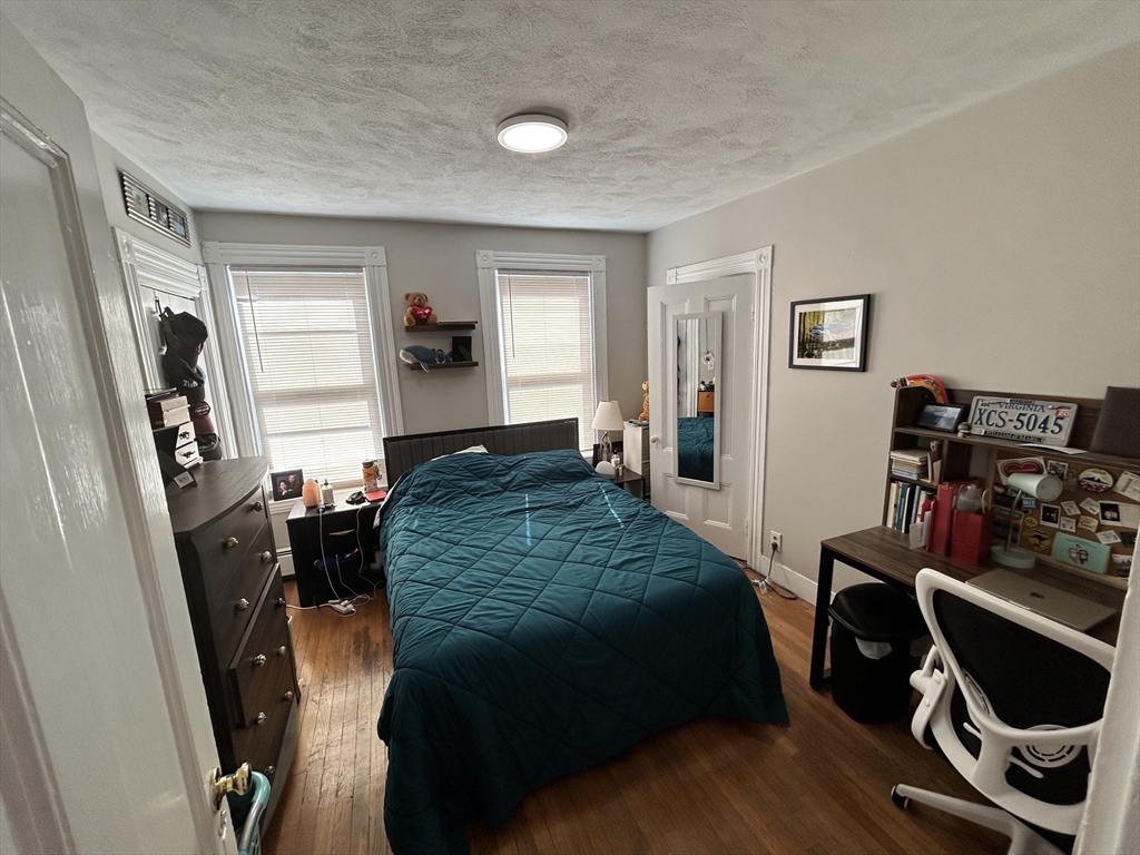 328 Beacon Street, Unit 2F Somerville, MA 02143 - Photo 5 of 6 a bedroom with a bed and a window