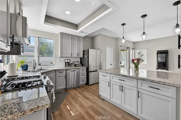 a kitchen with a sink stove and refrigerator