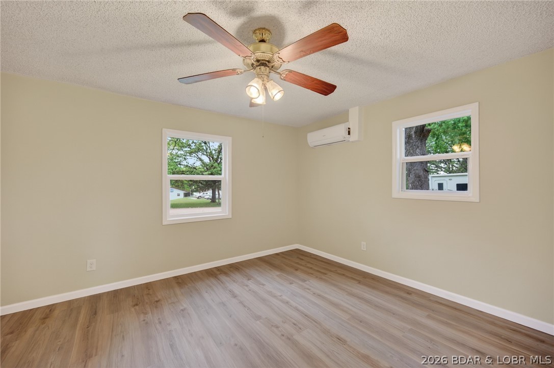 177 Storage Road Eldon, MO 65026 - Photo 23 of 34 Guest bedroom 2 is spacious and filled with abunda