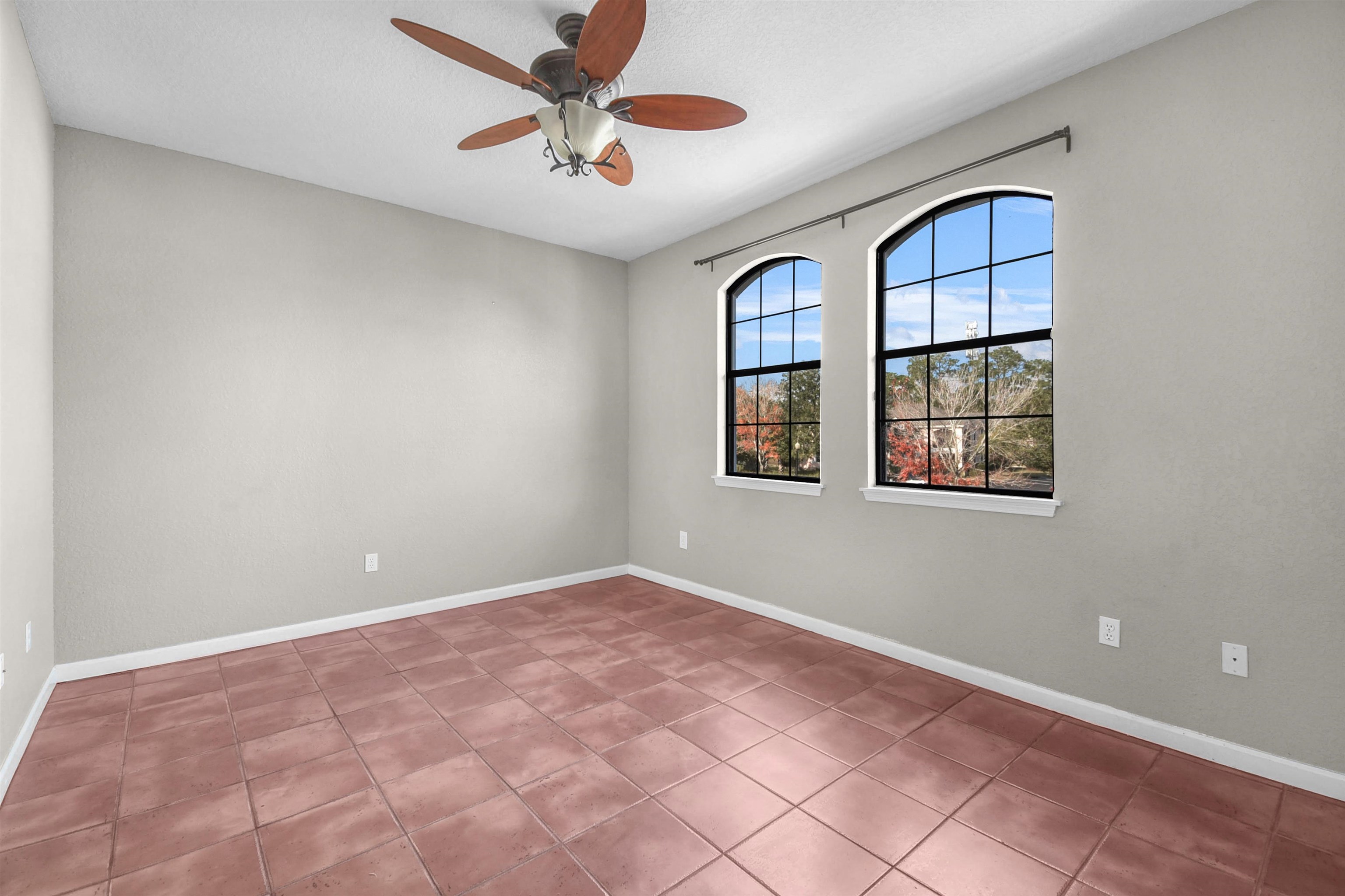 2221 Vista Cove Road St. Augustine, FL 32084 - Photo 13 of 30 an empty room with windows and fan