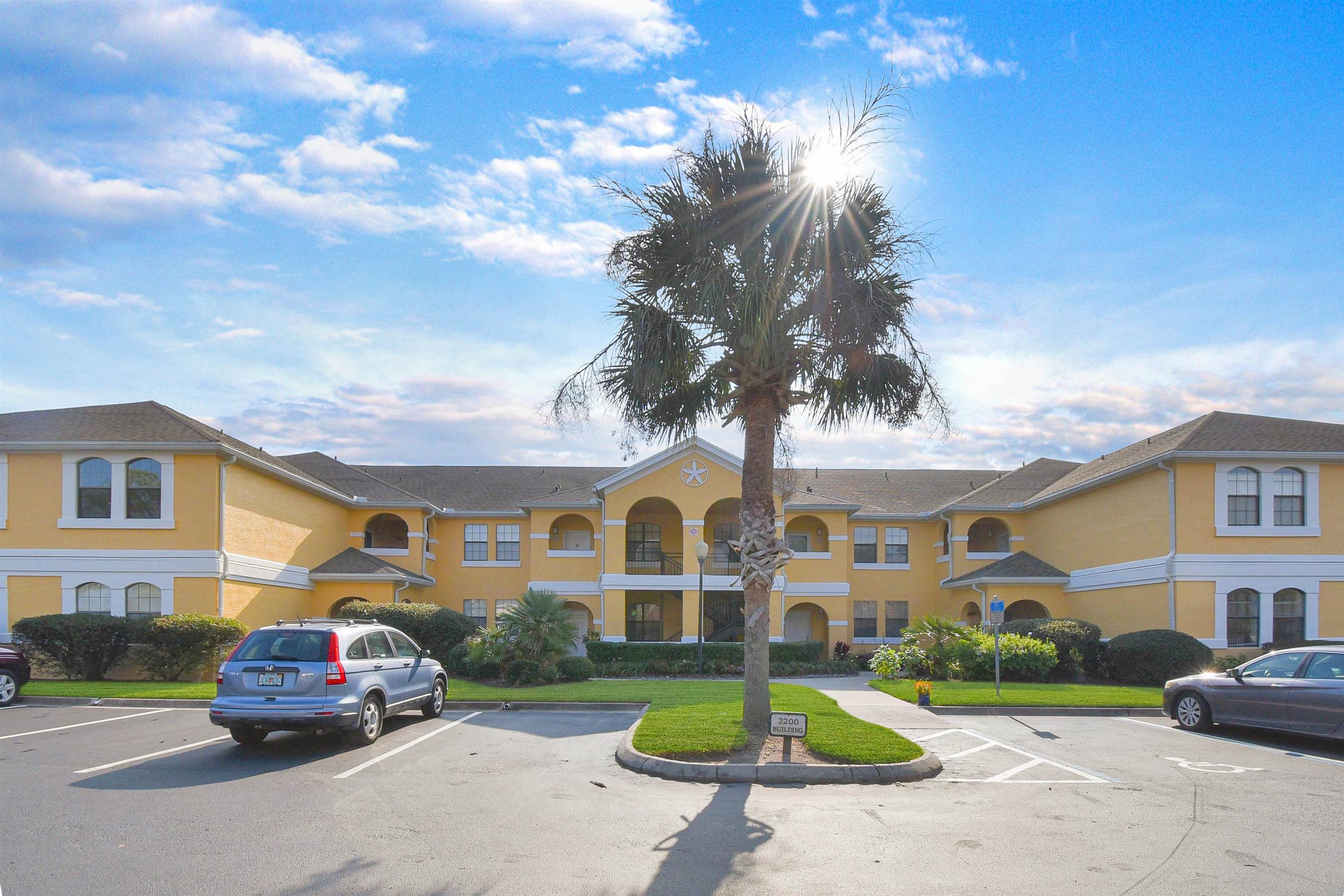 2221 Vista Cove Road St. Augustine, FL 32084 - Photo 2 of 30 a front view of a house with a garden and plants