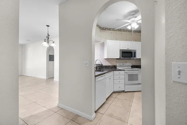 a white refrigerator freezer sitting in a kitchen