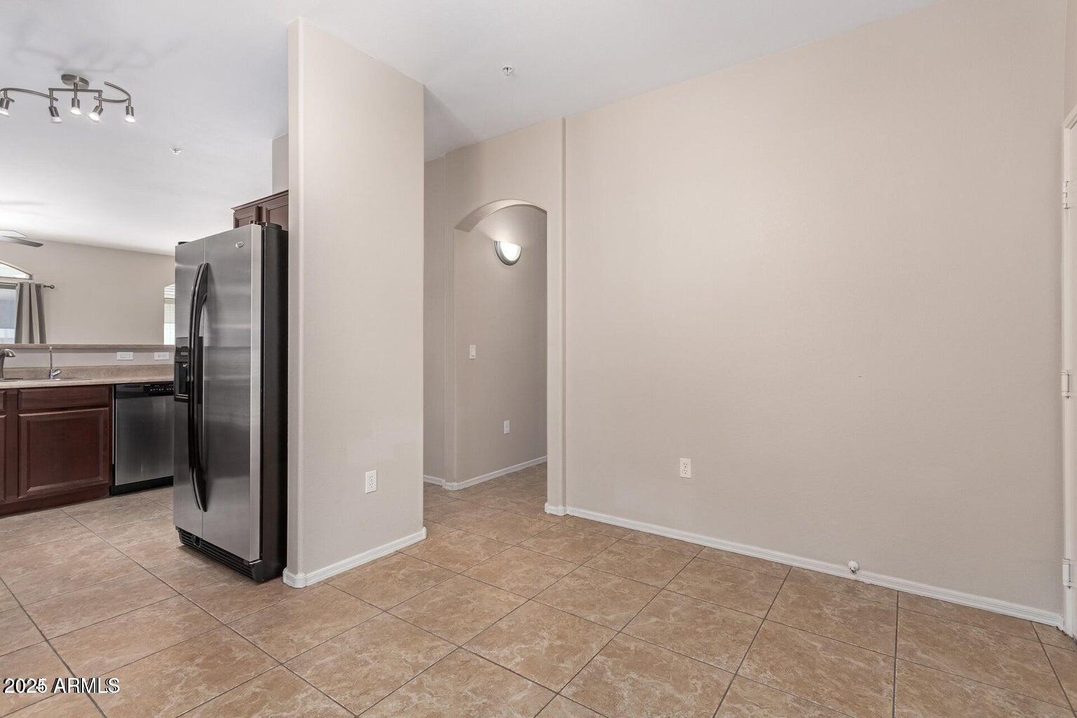2402 East 5th Street, Unit 1402 Tempe, AZ 85288 - Photo 11 of 36 a view of a kitchen with a sink and refrigerator