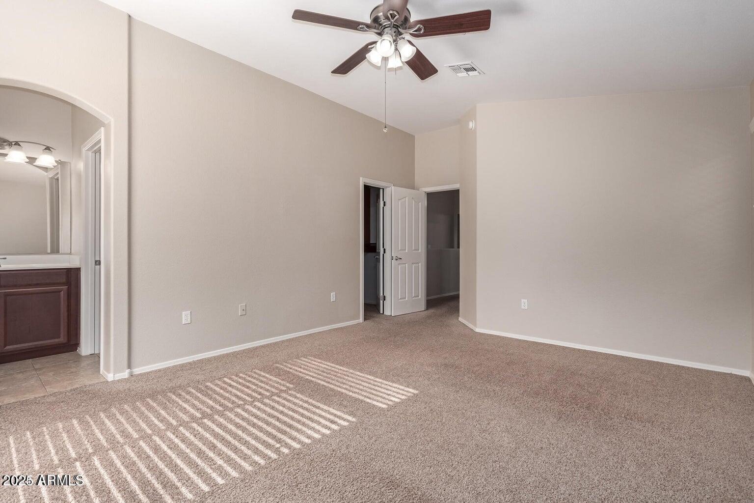 2402 East 5th Street, Unit 1402 Tempe, AZ 85288 - Photo 14 of 36 a view of empty room with a ceiling fan