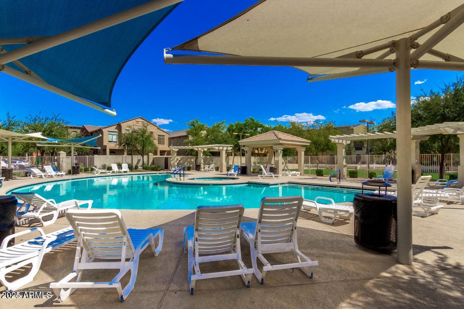 2402 East 5th Street, Unit 1402 Tempe, AZ 85288 - Photo 25 of 36 a view of a chairs and table in patio