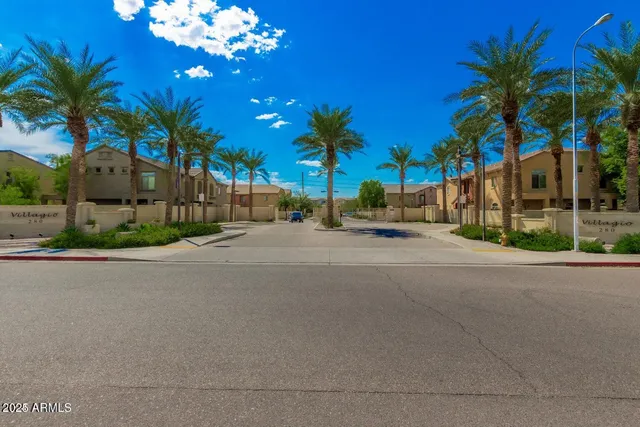 a view of a backyard with large trees