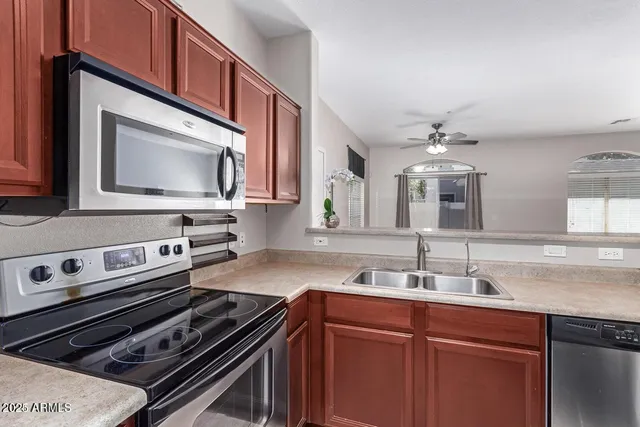a kitchen with a stove and a sink