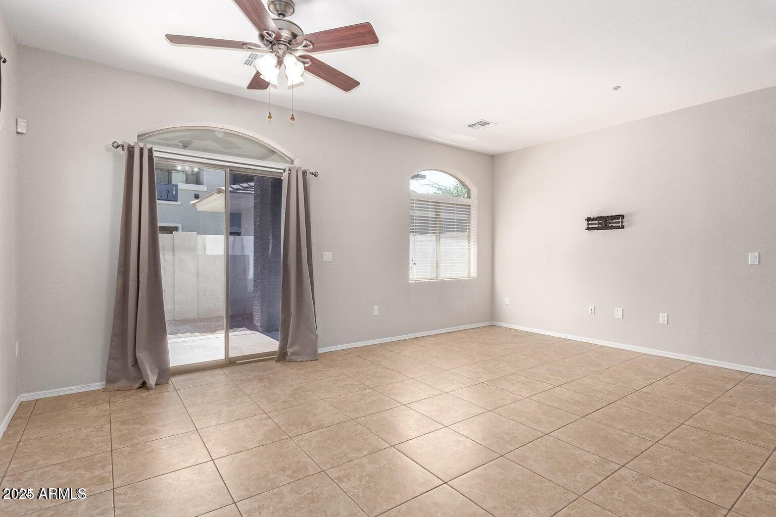 2402 East 5th Street, Unit 1402 Tempe, AZ 85288 - Photo 6 of 36 a view of an empty room with a window