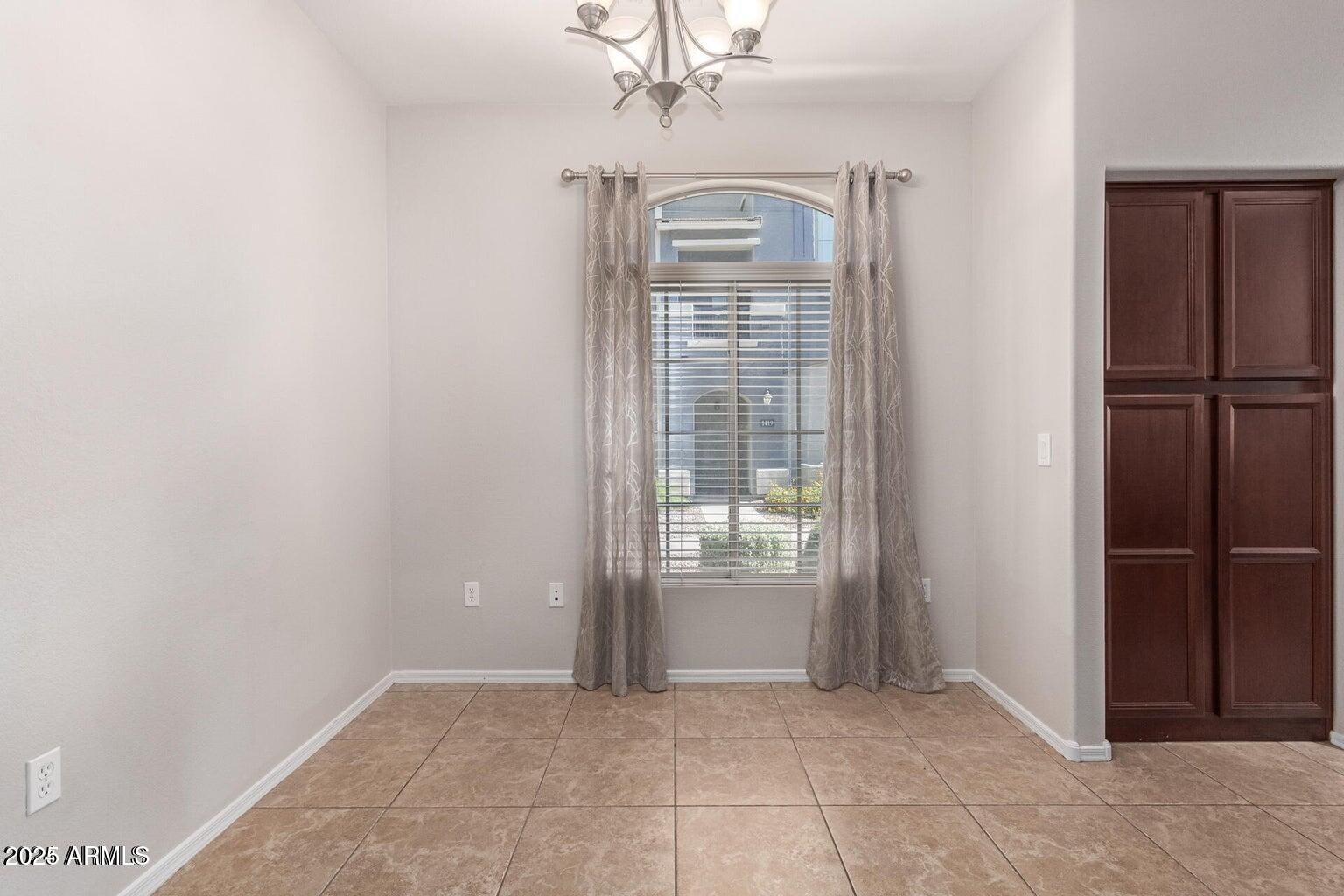 2402 East 5th Street, Unit 1402 Tempe, AZ 85288 - Photo 10 of 36 wooden floor in an empty room