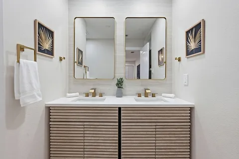 a bathroom with a shower sink and mirror
