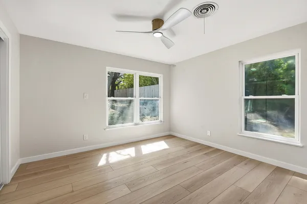 a work room with furniture and windows