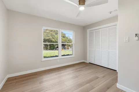 a bathroom with a sink toilet and mirror