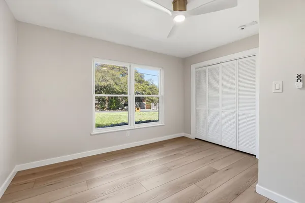 a bathroom with a sink toilet and mirror