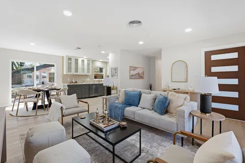 a view of a swimming pool with an outdoor space and seating area